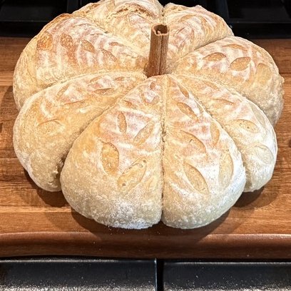 Pumpkin-shaped sourdough loaf with a cinnamon-stick stem
